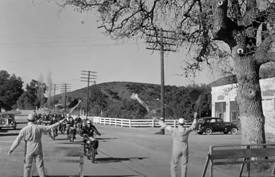 Group of motorcyclists heading towards a checkpoint